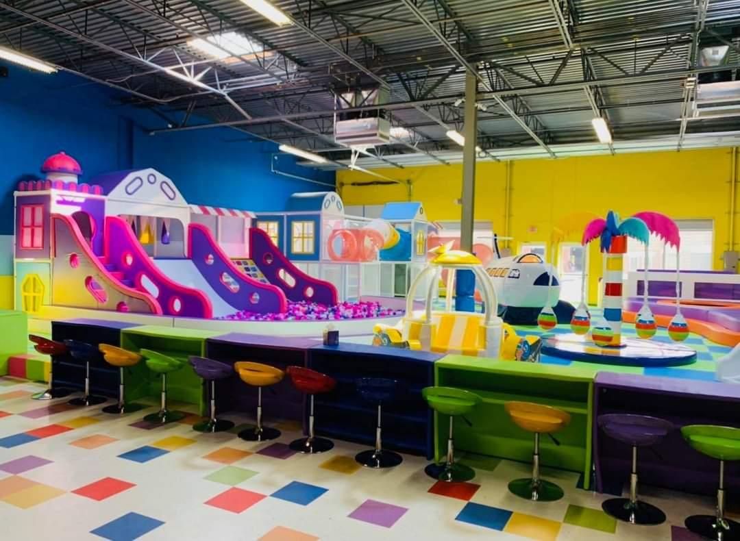 Colorful indoor play structures and café seating at Bubala Eldersburg
